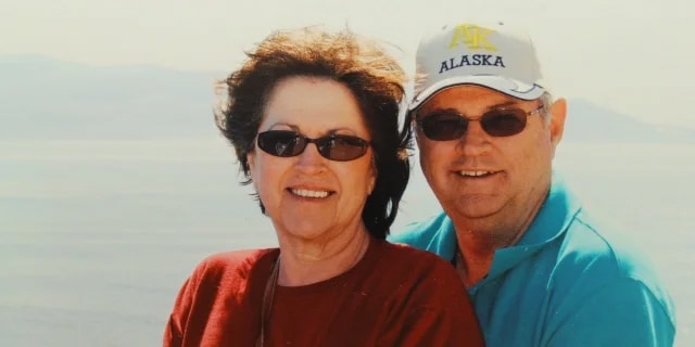 elderly couple smiling together