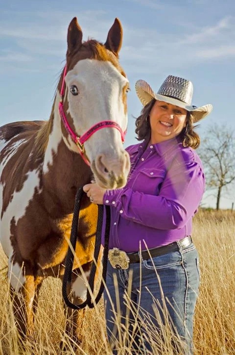 Amy before her weight loss next to a horse