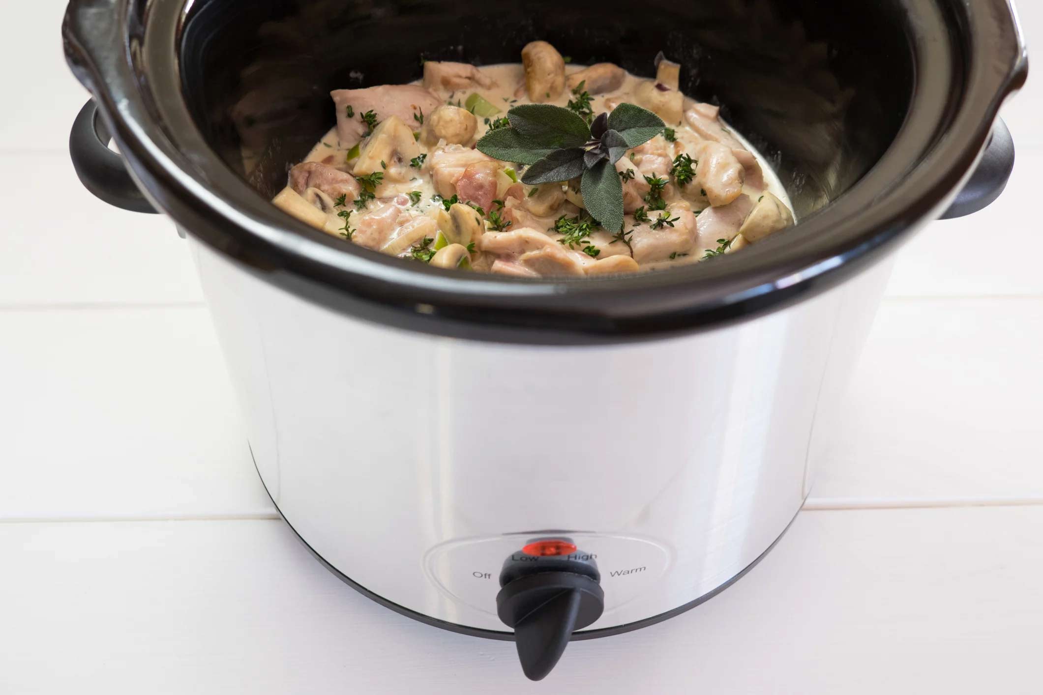 slow cooker with food inside