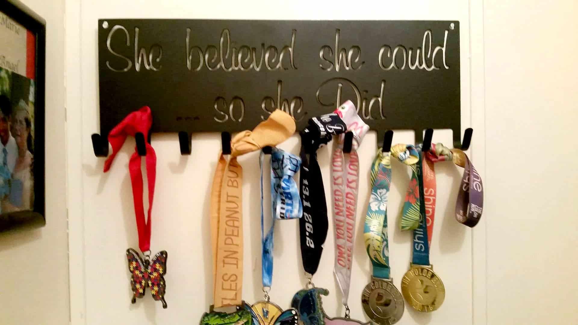 medal collection hanging on pegs