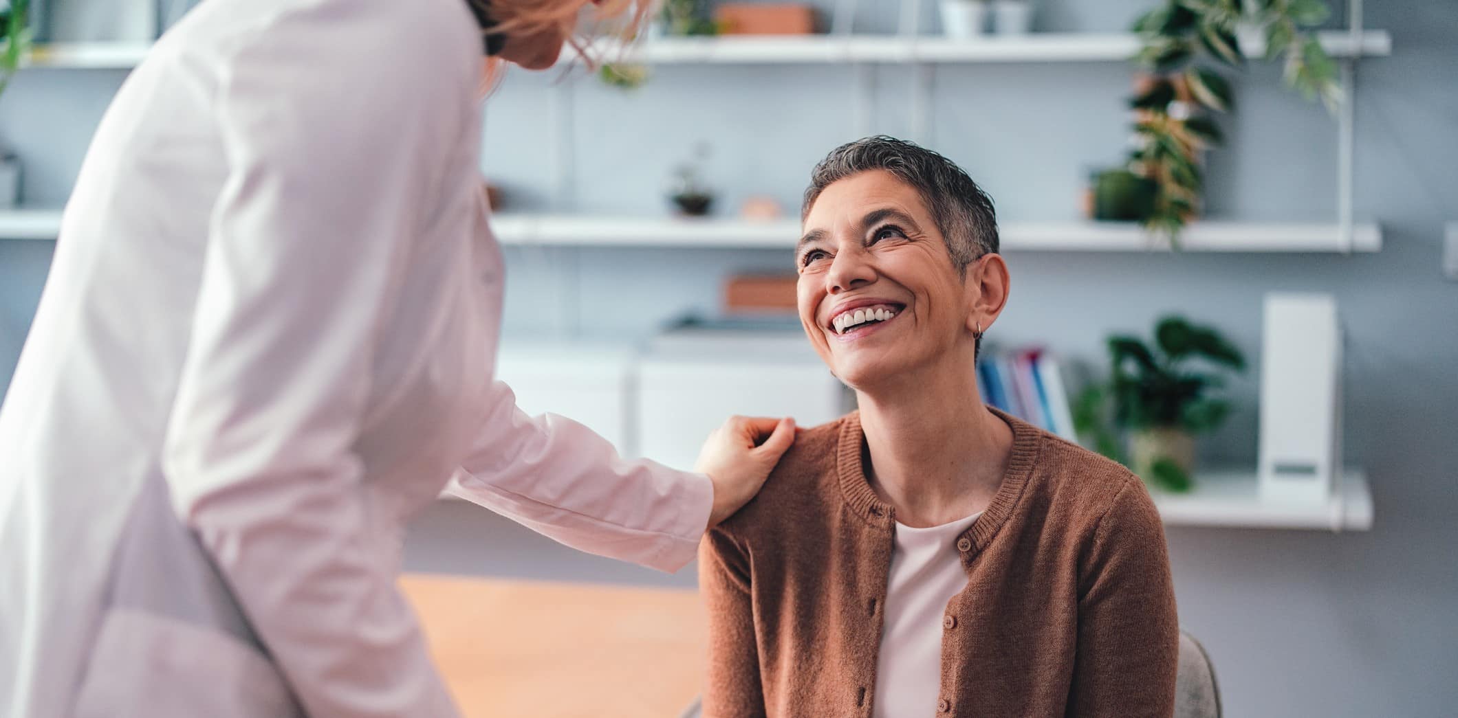 Woman smiling at physician