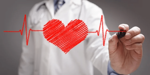 doctor drawing a heart line on glass