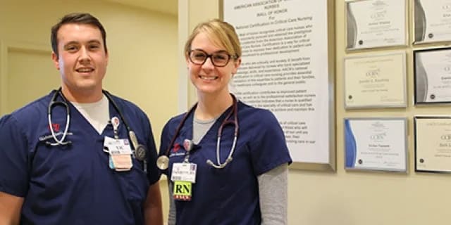 two RNs in blue shirts