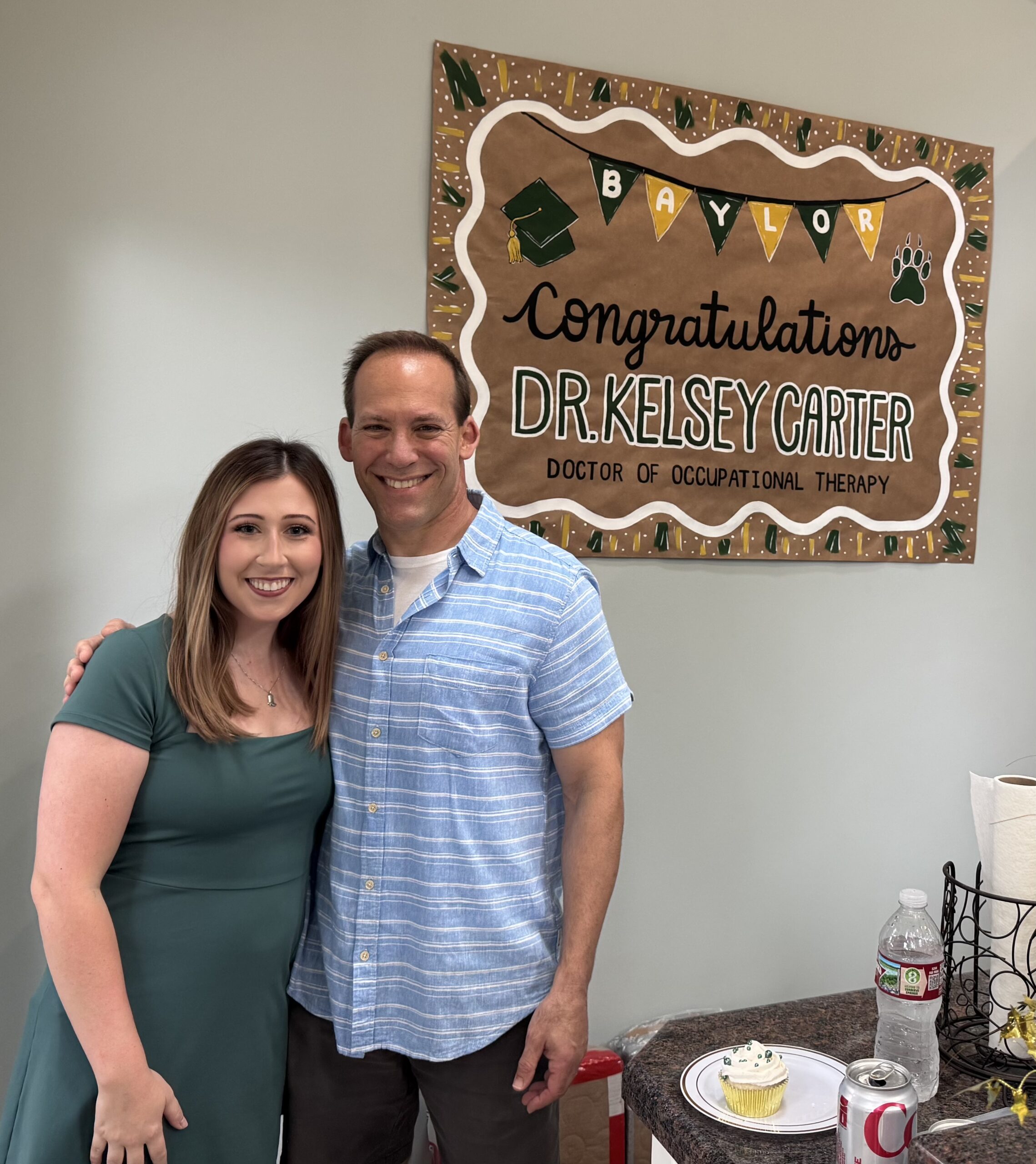 Kelsey Carter with Dr. Curtis Marti at her graduation party.