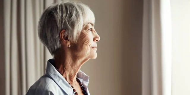 older woman looking outward