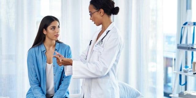 woman talking to her doctor