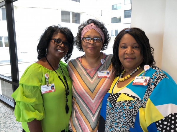 three woman posing together